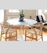 100cm Round White Carrara Marble Dining Table with four wishbone style chairs