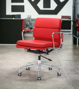 A premium leather low back office chair with a chrome aluminium frame and base, nylon castors, and various leather color options displayed.