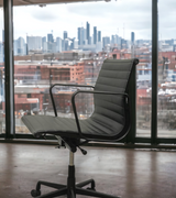 Midcentury Style Ribbed Leather Swivel Office Chair with a Black Frame