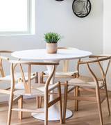 110cm Round White Wooden Top Tulip Dining Table with four wishbone chairs