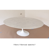 White Carrara marble tulip style dining table with a bevelled edge on a slender pedestal base, 170cm in diameter and 110cm in height, with a white gloss finish on the base.