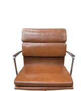 Brown leather chair with metal armrests on a white background