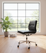 Swivel cushioned black leather office chair without arms