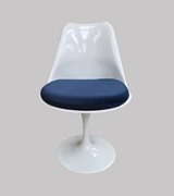 tulip chair with a dark navy blue velvet cushion
