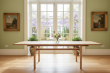 A traditional refectory style dining table made of solid ash wood with a natural finish, designed to seat 8 to 10 people, at 2.5 meter length.