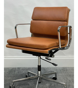 A vintage tan  office chair with a polished chromed aluminium frame and a five-point wheeled base.