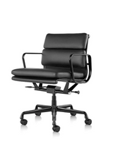 Low back office chair in black premium leather with black swivel base on white background